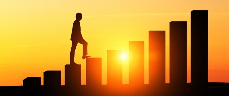 Man walking up milestone steps